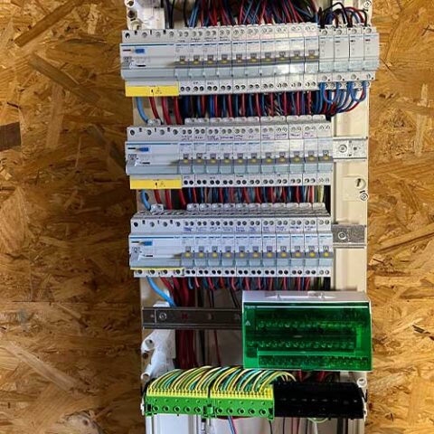electrician-le-biot Skilled electrician working on home electrical system repair in Le Biot residential area